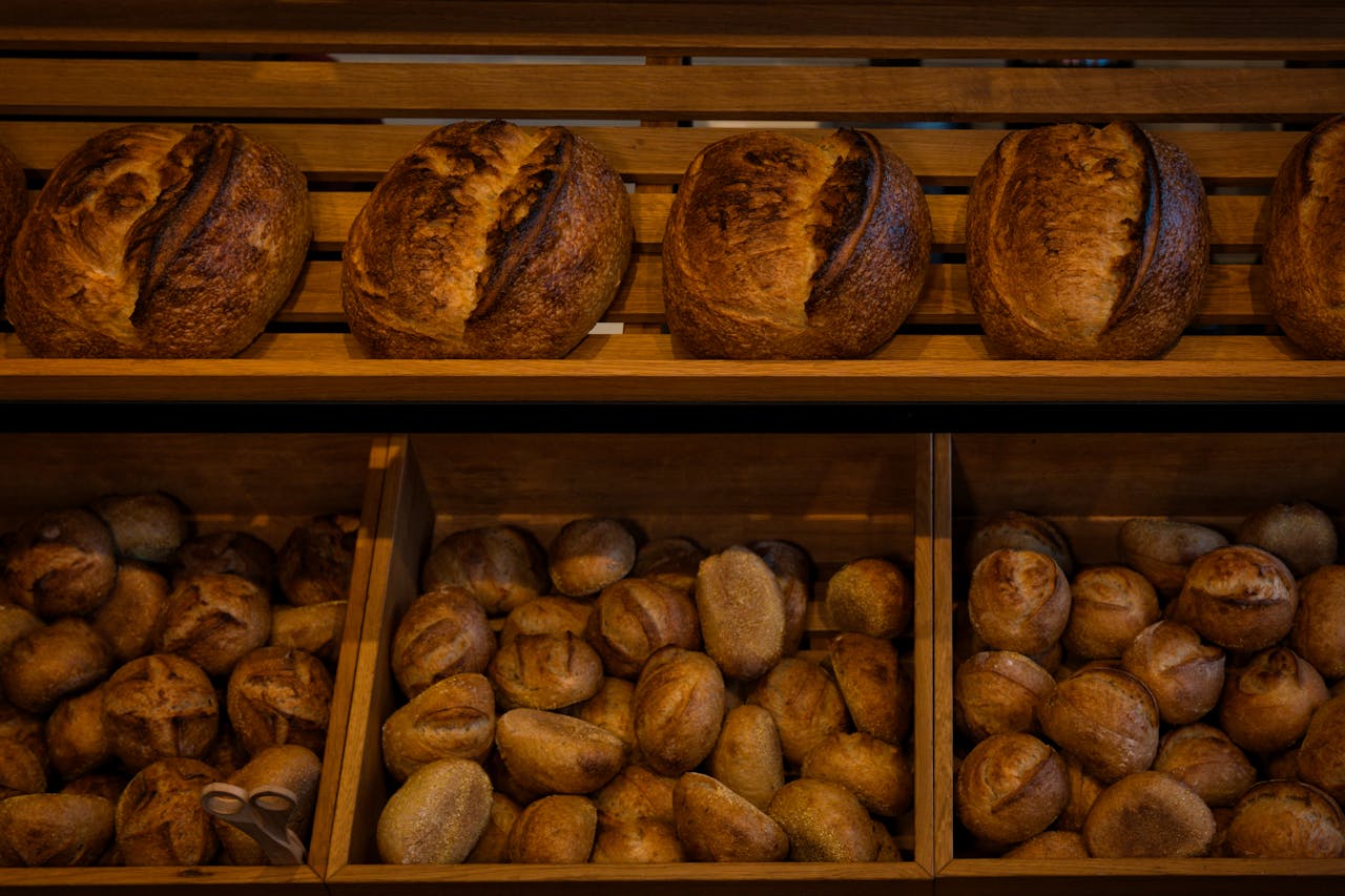 Rich selection of freshly baked artisan bread in a Berlin bakery shop.